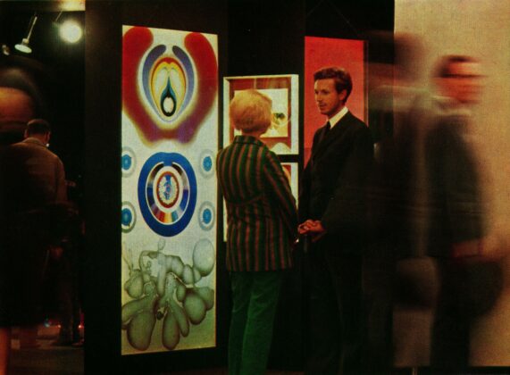 Raimund Thomas at Koelner Kunstmarkt 1968 in front of works by Gernot Bubenik